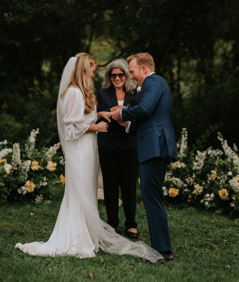 Bride and groom in the garden with Wedding Officiant Alice Soloway